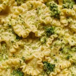 Close-up of Mafaldine Pasta Limone With Broccoli coated in a creamy lemon Parmesan sauce with tender broccoli pieces and perfectly cooked mafaldine pasta.
