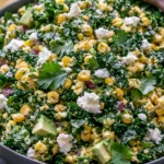 Mexican Street Corn Kale Salad with grilled corn, tender kale, creamy avocado, cotija cheese, fresh cilantro, red onion, and a zesty cilantro lime dressing.