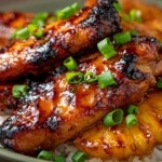 Hawaiian Teriyaki Chicken with caramelized pineapple served over steamed rice and topped with fresh green onions.