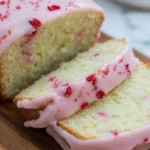 Close-up of Raspberry Glazed Key Lime Cake slices with pink raspberry glaze and tender citrus crumb.