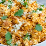 Fritos Corn Salad with Chili Cheese Fritos, sweet corn, shredded Mexican cheese, creamy mayo, and fresh cilantro served in a bowl for an easy party side.