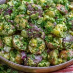French Potato Salad made with baby red potatoes, fresh parsley, dill, green onions, and Dijon mustard tossed in a light herb vinaigrette.
